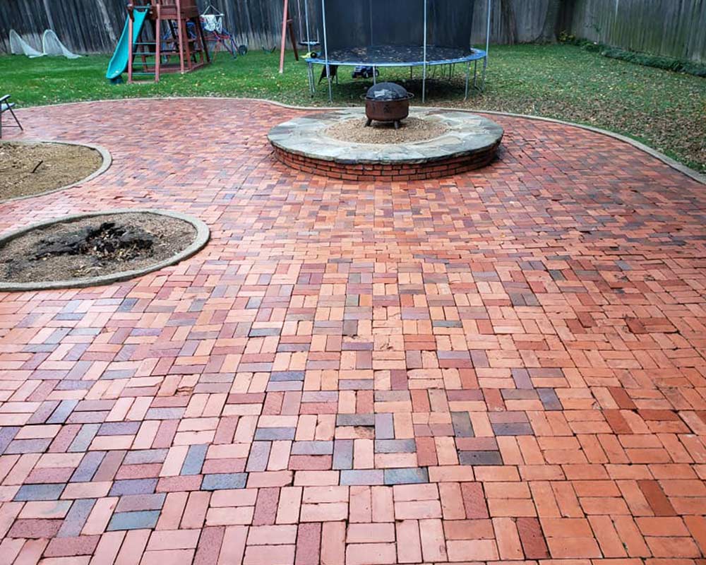 brick patio in backyard just pressure washed dallas tx